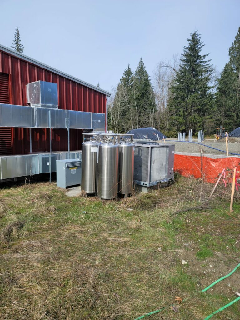 Commercial HVAC System and Tanks Beside Industrial Building