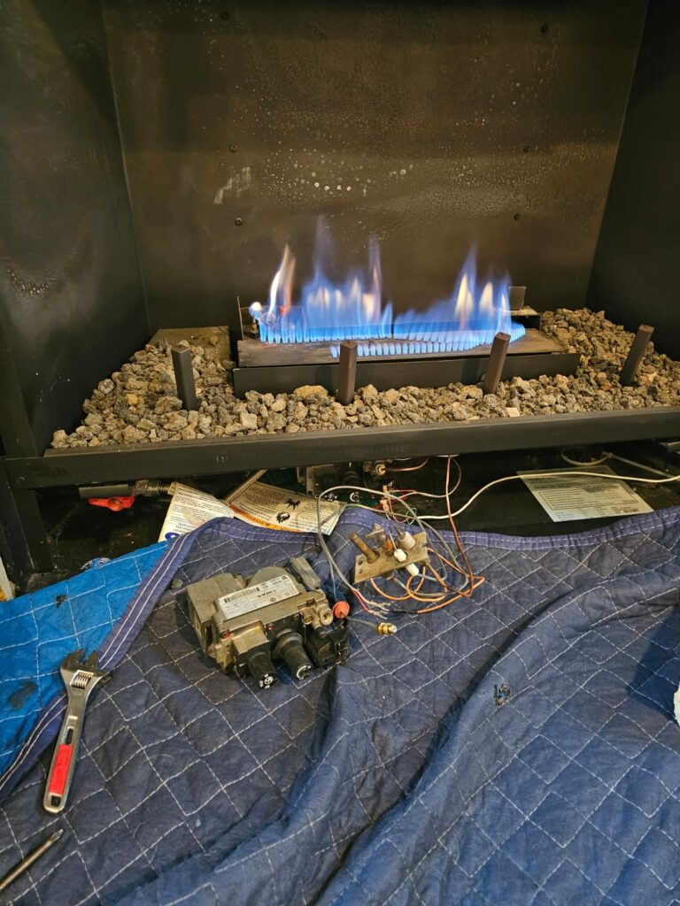 Gas Fireplace Service and Repair with Exposed Valve Assembly