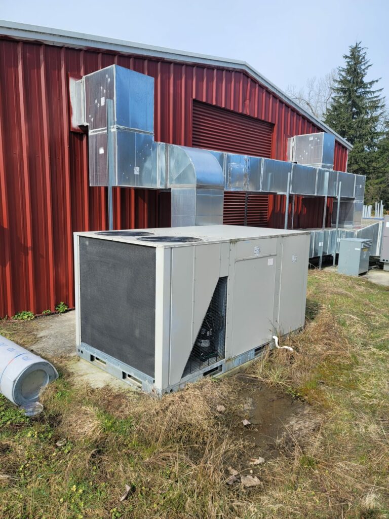 Industrial HVAC System and Ductwork on the Exterior of a Metal Building