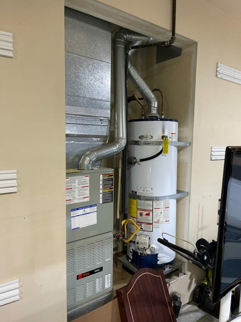 Modern Trane Furnace and Gas Water Heater Setup in a Home Utility Area