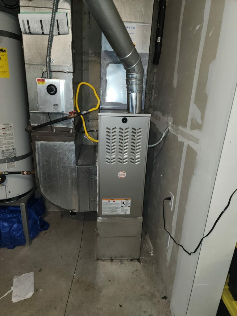 New Payne Furnace Installation with Ductwork in a Residential Utility Space