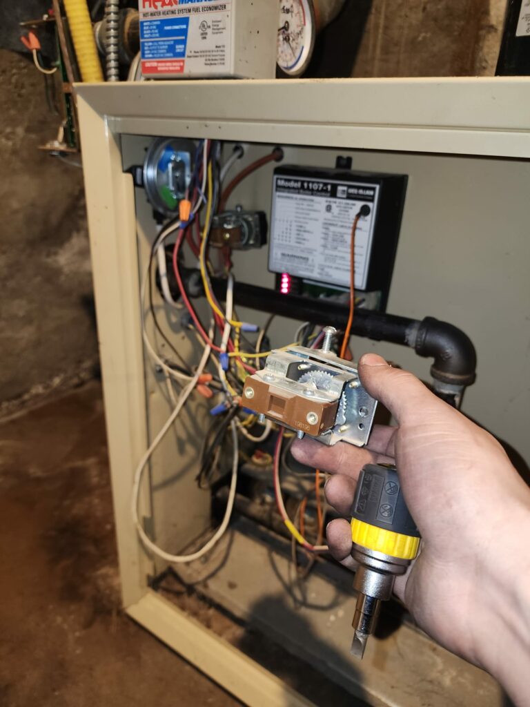 Replacing Ignitor in Gas Furnace During HVAC Maintenance